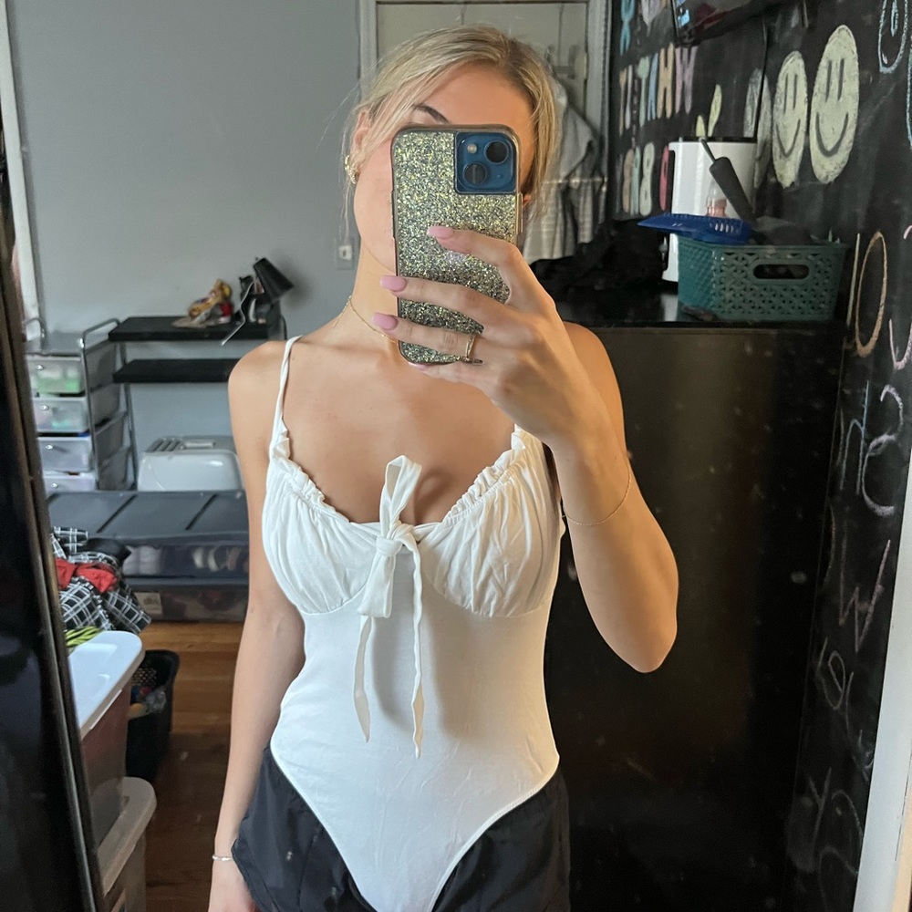 white body suit with tie
